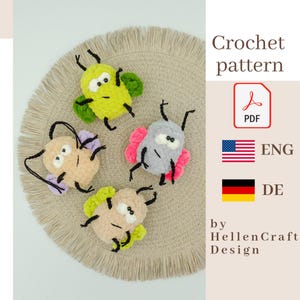 May include: Four handmade crochet bug toys in various colors, including yellow, pink, and beige, with black antennae and legs. The bugs are arranged on a beige circular placemat. The image also includes the text "Crochet pattern" and "by HellenCraft Design".