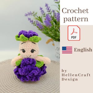 May include: A handmade crochet doll with a purple body, green and purple headpiece, and light pink arms. The doll is sitting on a neutral-colored surface. The image also includes text that says "Crochet pattern" and "English".