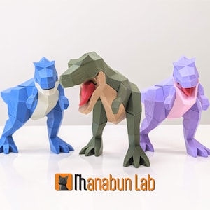 May include: Three low-poly dinosaur figurines, one blue, one green, and one purple, with open mouths and red tongues. The figurines are made of plastic and are about 5 inches tall. The dinosaurs are standing on a white surface. The image includes the text "Thanabun Lab".