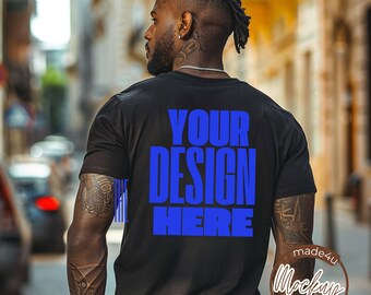 May include: A black t-shirt with the text "YOUR DESIGN HERE" in blue letters on the back.