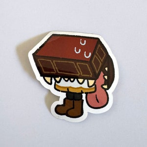 May include: A brown chocolate bar sticker with a cartoon character with a chocolate bar head and a pink tongue sticking out.