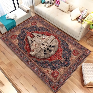 May include: A rectangular rug with a red and navy blue floral design. The rug has a detailed image of the Millennium Falcon spaceship in the centre. The rug is placed on a wooden floor.