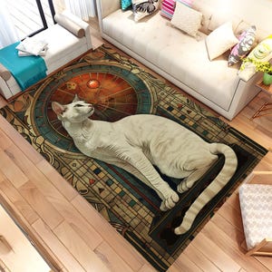 May include: A patterned area rug with a geometric design and a central circular motif in brown, orange, and teal. A white cat is lying on the rug. The rug is placed on a wooden floor, with a white sofa and cushions visible in the background.