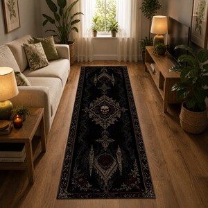 May include: A long rectangular runner rug featuring a dark black background with intricate white and deep red ornate patterns. The design includes a central skull motif surrounded by symmetrical filigree and decorative border elements.