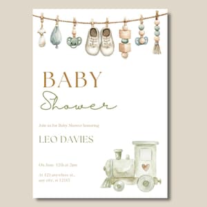 May include: A watercolor baby shower invitation with the words "BABY Shower" in brown and green. The invitation includes baby shoes, pacifiers, and toys hanging from a clothesline. The invitation is for Leo Davies, with the date and time of the shower.