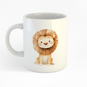 May include: White ceramic mug with a cartoon illustration of a brown lion with a light brown mane. The lion is sitting with its paws in front of it and has a friendly expression.