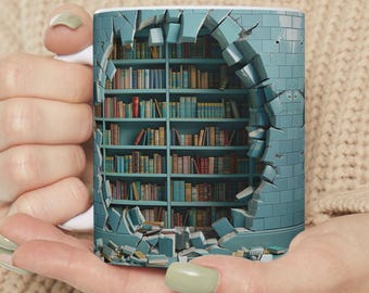 May include: A white ceramic mug featuring a graphic print of a blue brick wall that appears to be broken open, revealing a multi-tiered wooden bookshelf filled with numerous colorful books arranged neatly on the shelves within the wall cavity.