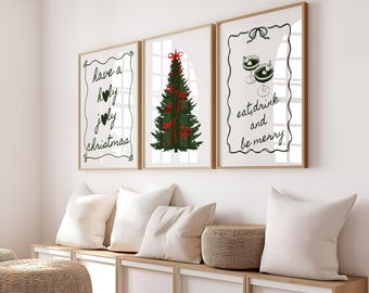May include: Three framed prints with Christmas-themed illustrations and text. The left print says "have a holly jolly christmas". The middle print shows a green Christmas tree with red bows. The right print says "eat, drink and be merry".