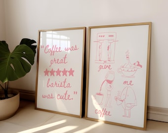 May include: Two framed prints with pink text and illustrations. The first print says "Coffee was great" with five stars and "barista was cute." The second print shows a coffee maker with a person pouring coffee into a cup with the text "give me coffee."