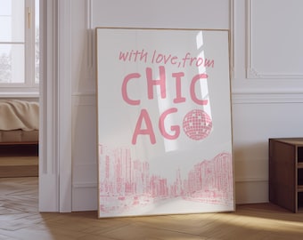 Op de afbeelding: Een ingelijste kunstprint met de tekst "with love, from CHICAGO" in roze. Het ontwerp bevat een roze discobal en een stadsgezicht illustratie. Het kunstwerk wordt getoond tegen een witte achtergrond.