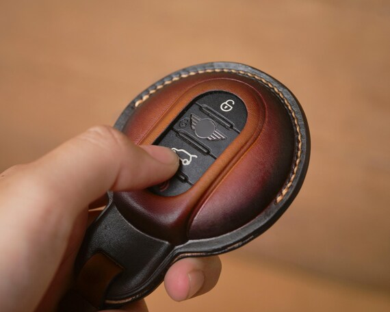 A handcrafted leather key fob cover made specifically for Mini Cooper models — hyper-niche personalization that Mini owners will obsess over.