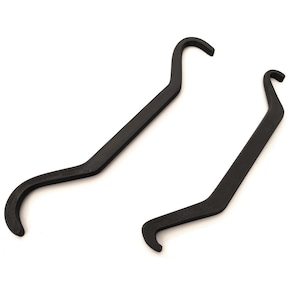 May include: Two black metal tools with curved ends, designed for specific tasks. The tools have a hook-like shape at one end and a curved handle. The tools are set against a white background.