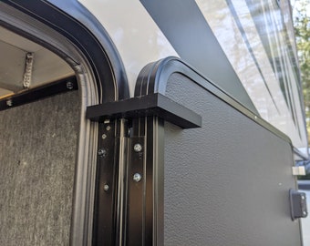 RV F-stop to hold baggage doors open