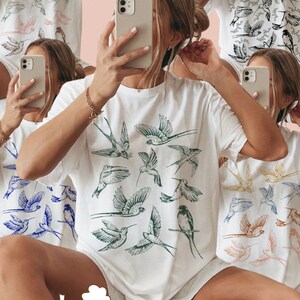 May include: White t-shirts with various bird illustrations in blue, green, and peach. The image includes the text "BUNDLE! 5 PNGS" and "FREE COMMERCIAL USE!" and "PNG FILE".