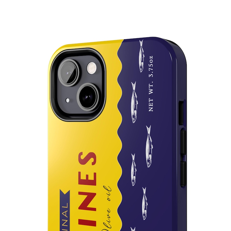 Phone case designed as a vintage sardine tin can with silver fish illustration and pull-tab detail on a bold yellow and navy background – retro foodie aesthetic.