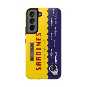 Samsung Phone case designed as a vintage sardine tin can with silver fish illustration and pull-tab detail on a bold yellow and navy background – retro foodie aesthetic.