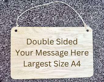 May include: A wooden sign with a white string for hanging. The sign is double-sided and says "Double Sided Your Message Here Largest Size A4".