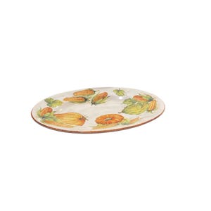 May include: Oval ceramic serving platter with a hand-painted design of corn, squash, and leaves. The rim has a brown border. The vegetables are in shades of yellow, orange, and green against a cream background.