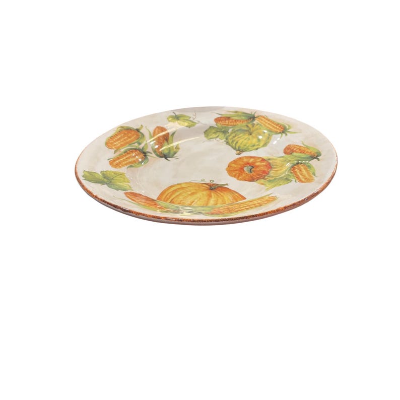 May include: A round, off-white ceramic serving platter with a painted harvest theme. The platter features images of pumpkins, corn, and leaves in shades of orange, yellow, and green. The rim has a brown, textured border.