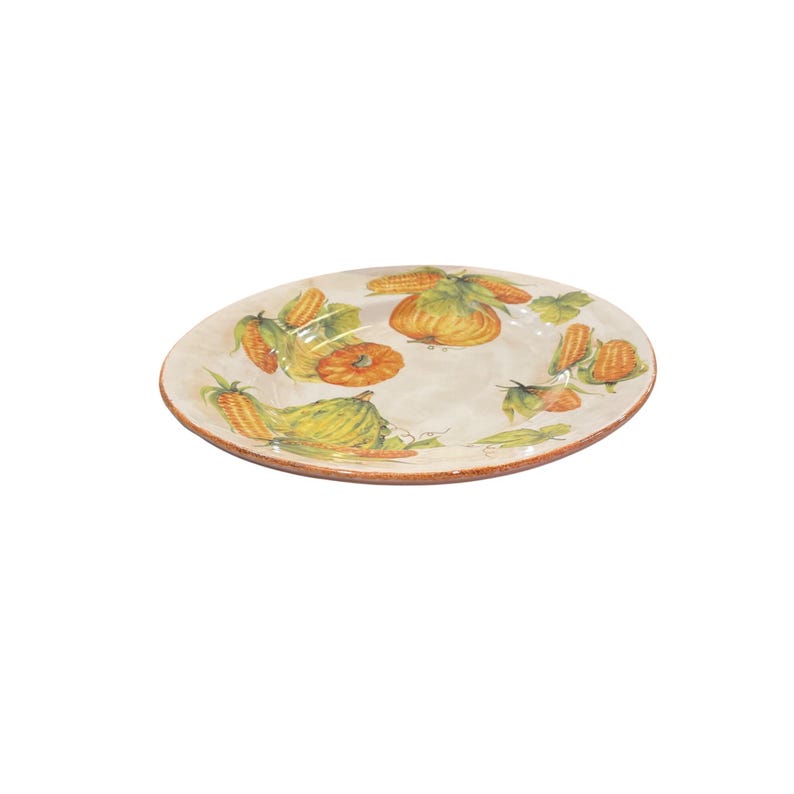 May include: Oval ceramic serving platter with a cream-colored background. The platter is decorated with hand-painted images of pumpkins, corn, and leaves in shades of orange, yellow, and green. The rim of the platter has a brown border.
