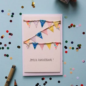 Carte postale double, message "Joyeux anniversaire", fanions en masking tape rose, jaune et bleu