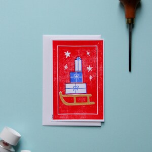 Carte postale simple linogravure "Luge de Noël"