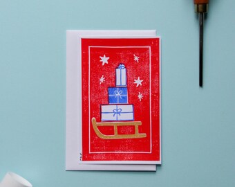 Carte postale simple linogravure "Luge de Noël"