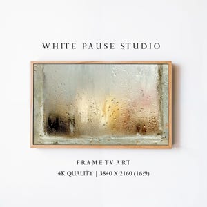 Peut inclure: Une œuvre d'art encadrée représentant une scène de fenêtre brumeuse. L'œuvre est dans un cadre en bois de couleur claire. Le texte "WHITE PAUSE STUDIO" est en haut, et "FRAME TV ART" et "4K QUALITY | 3840 X 2160 (16:9)" sont en bas.