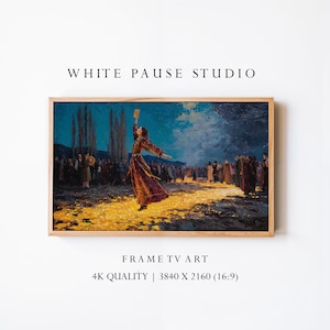 May include: A framed print of a painting depicting a woman in a long, flowing dress, holding an object aloft, surrounded by a crowd. The artwork is set against a backdrop of a night sky and a golden path. The frame is made of light-colored wood. The text "WHITE PAUSE STUDIO" and "FRAME TV ART" are visible.