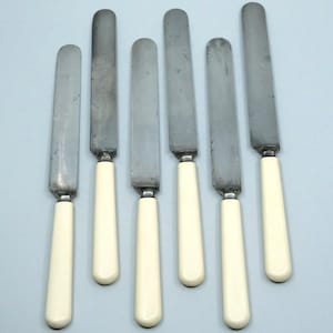 J Russell & Co Green River Works Set 6 White Handled Carbon Steel Dinner Knives