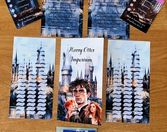 May include: A collection of printed cards and game pieces featuring imagery from a fantasy theme. The central card displays the text "Harry Otter Imperium" with character portraits. Other cards have castle illustrations and German text.