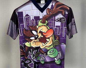 TAZ 1999 Looney Tunes Shirt · Taz Devil Tune On Extreme City Tee · Vintage Cartoon All Over Print Graphic V Neck Shirt · Skating Taz Tee 90s