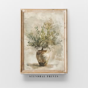 Peut inclure: Une impression encadrée d'une peinture à l'aquarelle représentant une branche d'olivier verte dans un vase en céramique brun. L'arrière-plan est beige mat avec de subtiles coups de pinceau.