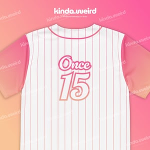 May include: White baseball jersey with pink stripes and a pink gradient on the sleeves. The back of the jersey has the text "Once 15" in a pink and orange gradient.