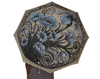 Paraguas vintage azul oscuro con estampado floral, parasol plegable y compacto para la lluvia.