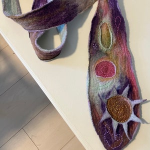 An artist’s wet-felted tie with embroidery details