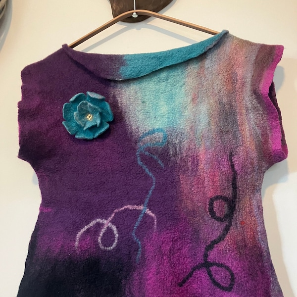 A Merino wool top with flower brooch in purples and greens. A gift for her; handcrafted and sustainable fashion in pure wool.