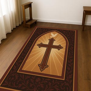 May include: Rectangular area rug featuring a large brown cross with a dove above it, set against a golden background with radiating light. The rug has a dark brown border with floral patterns. The rug is placed on a wooden floor.