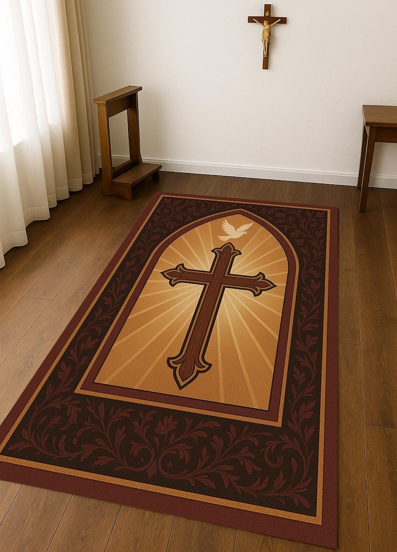 May include: Rectangular area rug featuring a large brown cross with a dove above it, set against a golden background with radiating light. The rug has a dark brown border with floral patterns. The rug is placed on a wooden floor.