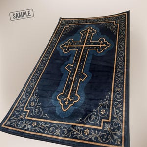 May include: A rectangular, dark blue rug with a large, ornate cross design in the center. The cross and border feature gold-colored filigree patterns. The word "SAMPLE" is in the upper left corner.