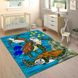 May include: A blue, green, and brown rug with a stained glass design of three sea turtles swimming in the ocean. Yellow fish are swimming around the turtles.