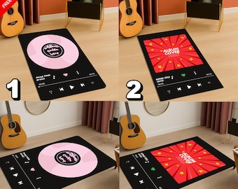 Könnte beinhalten: Schwarzer rechteckiger Teppich mit einem rosa Vinyl-Schallplatten-Design. Der Teppich verfügt über eine Musikplayer-Oberfläche mit Songtitel, Künstler und Wiedergabesteuerung. Der Text "Album Cover" ist ebenfalls sichtbar.