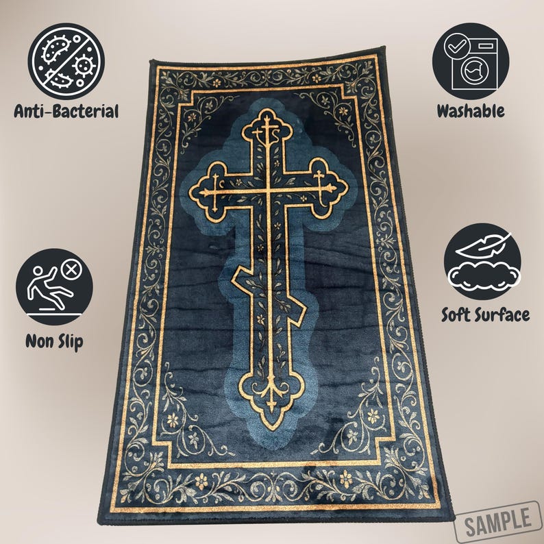 May include: A navy blue rug with a gold Orthodox cross design. The rug has a gold floral border and features icons indicating it is anti-bacterial, washable, non-slip, and has a soft surface.