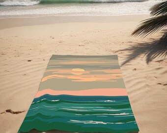 May include: A beach towel featuring a sunset over the ocean scene. The towel depicts a green and blue ocean with waves and a yellow sun in the sky. The sky is a light pink and grey colour.