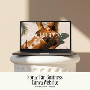May include: A dark gray laptop displaying a website template titled COCO GLOW with a photograph of a person in a brown bikini on a sandy beach. The laptop is positioned on a white cylindrical pedestal. The text below reads Spray Tan Business.
