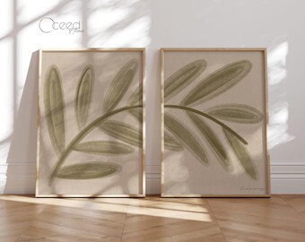 May include: Two framed prints with a minimalist design featuring a stylized green branch with leaves on a beige background.