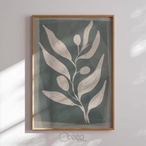 May include: A framed print of a stylized white branch with leaves and small white circles on a teal background.