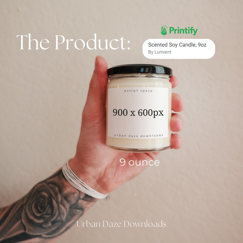 May include: A white soy candle in a clear glass jar with a black lid. The jar has a white label with the text "design space", "900 x 600px", "urban daze downloads", and "9 ounce".
