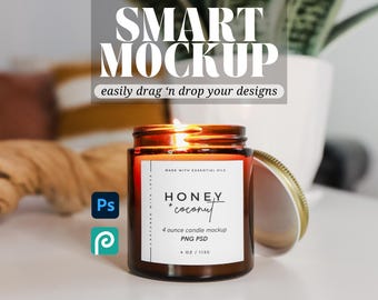 May include: A brown glass candle jar with a white label that reads "HONEY + coconut" and "4 ounce candle mockup PNG PSD". The candle is lit and the jar has a gold lid.