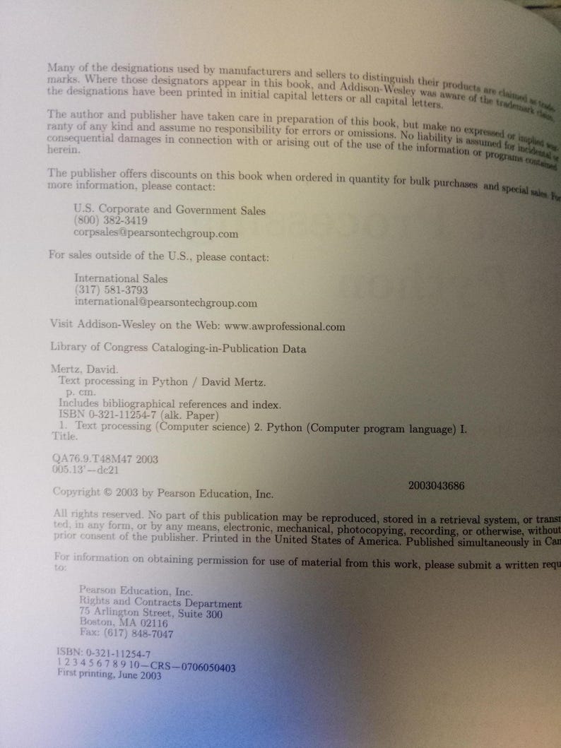 May include: A printed page with text from a book. The text includes contact information for sales and copyright details. The book's title is "Text processing in Python" by David Mertz. The ISBN is 0-321-11254-7.